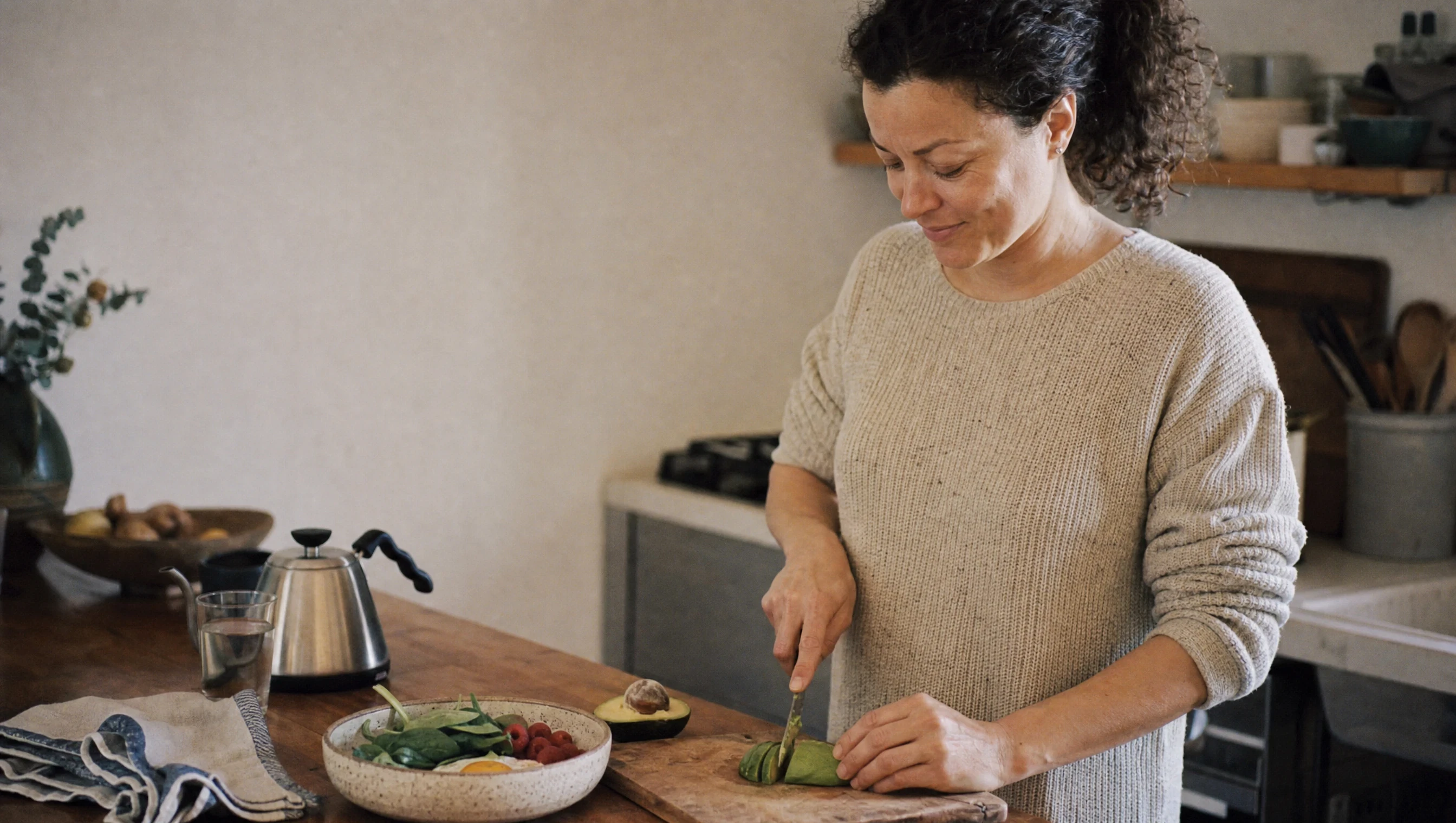 A member making breakfast at her kitchen counter